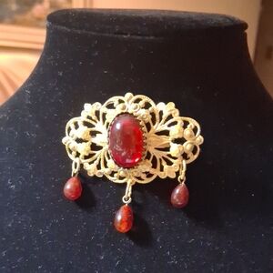 Vintage Gold Tone Brooch with Red "Stones"